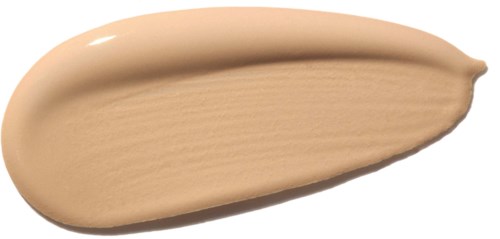 Ein beiges Make-up-Produkt, möglicherweise Foundation, mit glatter cremiger Textur.