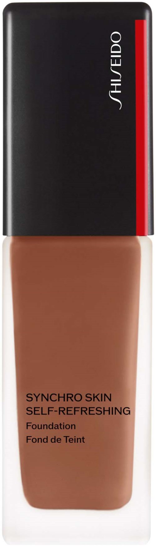 En flaska foundation med svart och rött lock av Shiseido, märkt 'Synchro Skin Self-Refreshing'.