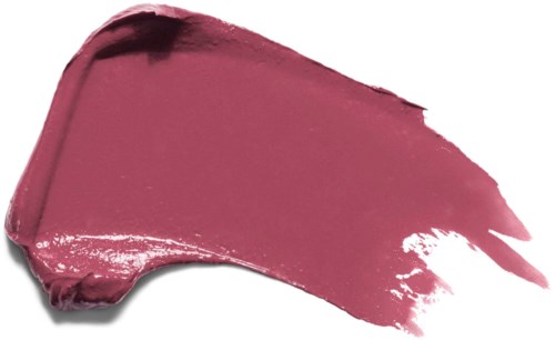 En borste av rosa läppstift syns mot en svart bakgrund med stänk och smuts.