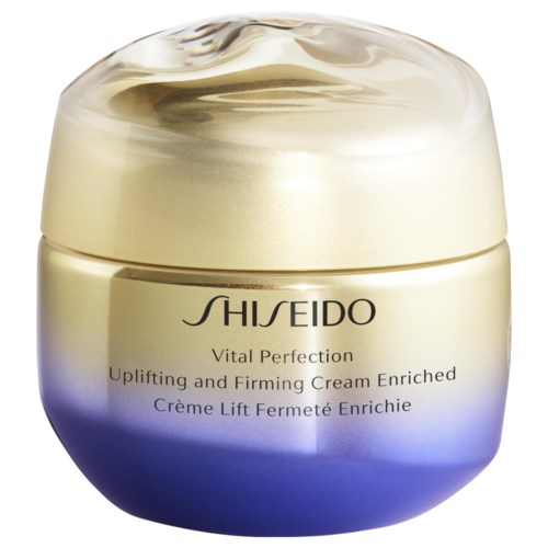 Ein Glas Shiseido Vital Perfection Creme, goldene und lila Farben, als anhebende und festigende Hautpflegeprodukt.