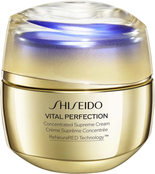 En gylden beholder med Shiseido hudplejecreme med blå og gennemsigtig låg.