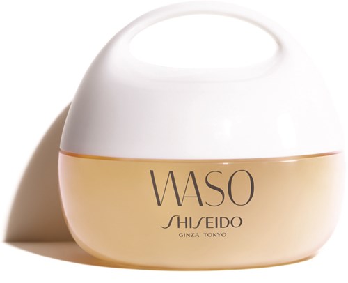En hvit og beige krukke med svart tekst som sier "WASO SHISEIDO GINZA TOKYO."