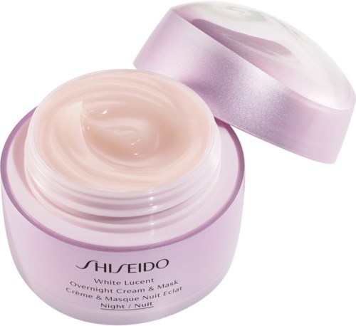 En pastel lila burk med en rosa kräm, märkt Shiseido White Lucent Overnight Cream & Mask, med locket lätt öppet.