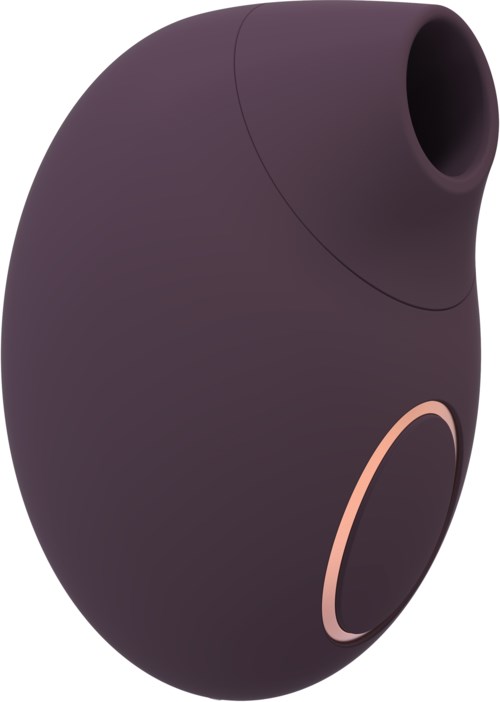 A small, oval-shaped device in dark purple with a pink ring, possibly a speaker or gadget.