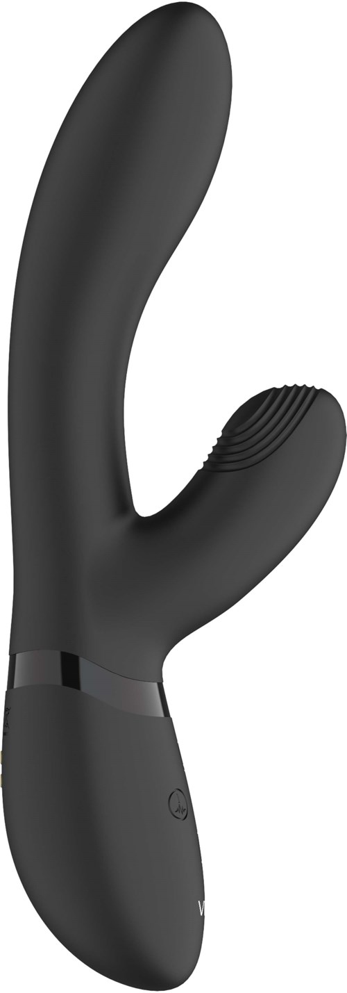 A black, curved adult toy with textured surface, ergonomic handle, designed for pleasure. Battery operated and waterproof.