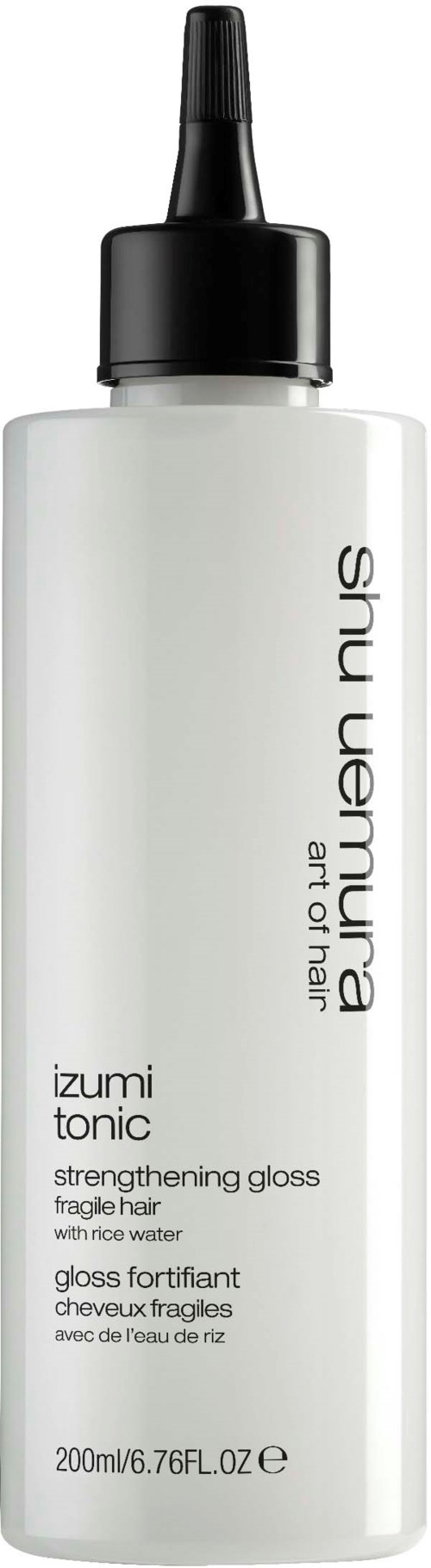 Biała butelka z czarną dyszą zawierająca produkt do włosów Shu Uemura, oznaczony jako Izumi Tonic wzmacniający włosy.