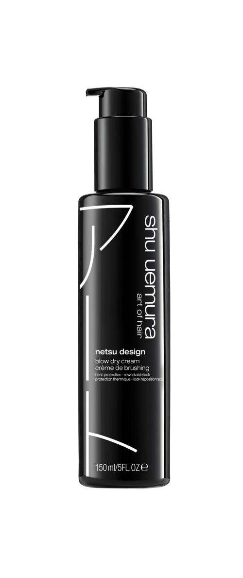 En svart flaska med pump, märkt 'n netsu design' och 'sun nurturing'.