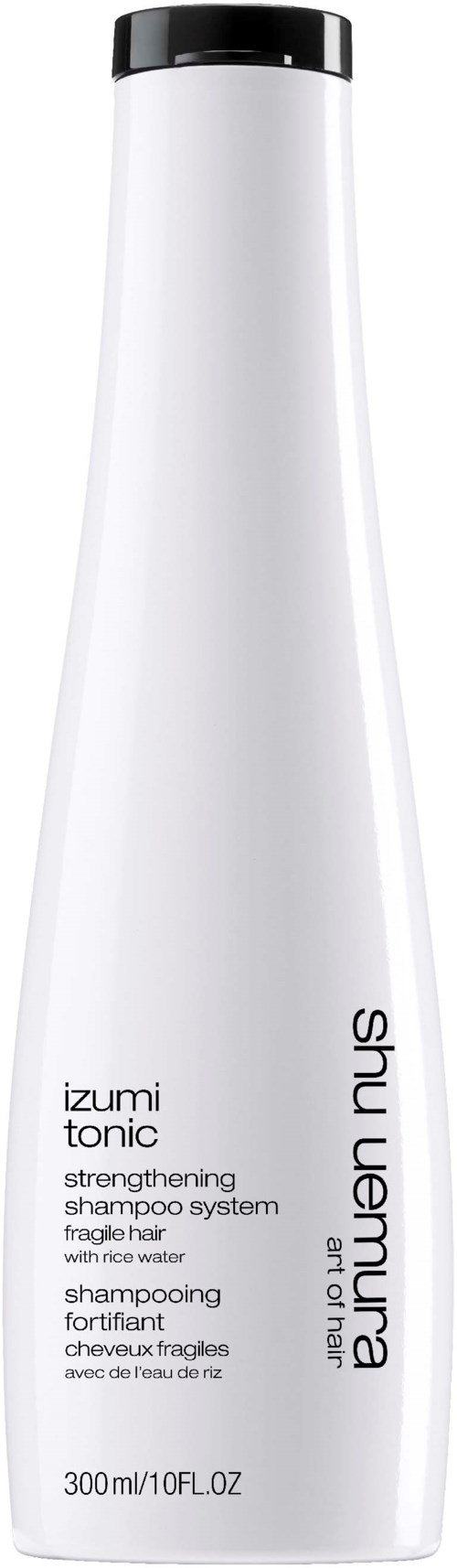 En lång vit flaska med svart lock. Den har text om schampo och hårstyrka, från Shu Uemura.