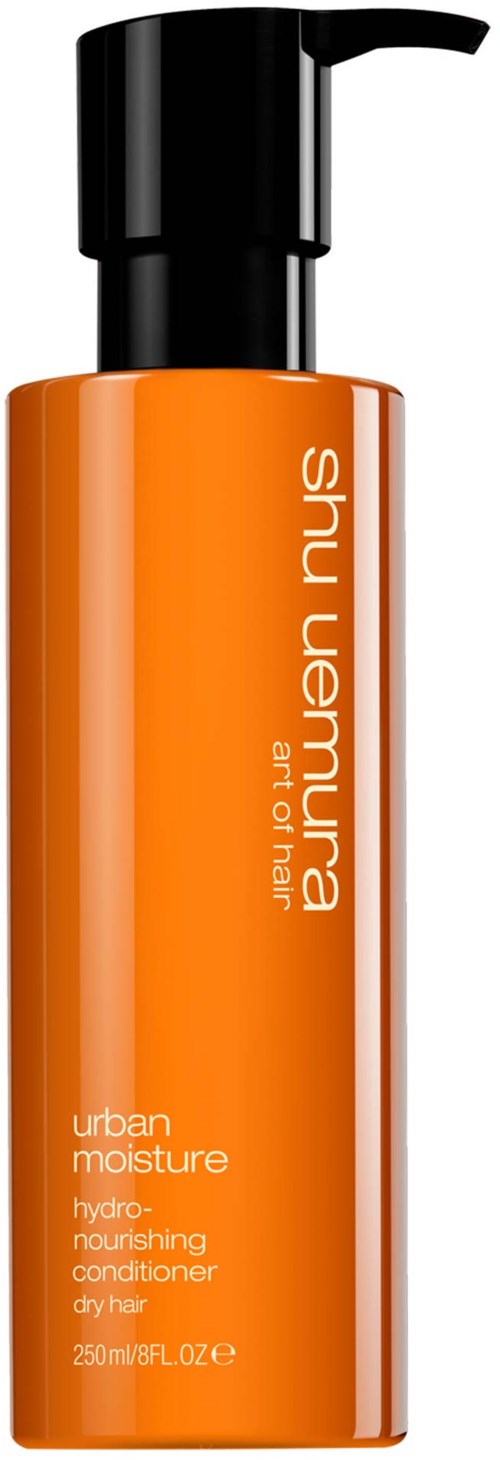 En orange flaska med svart pump, märkt 'Shu Uemura' och 'urban moisture'.