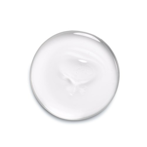 En klar, cirkelformad gel med glänsande yta och slät struktur, kanske en hudvårds- eller kosmetikprodukt.