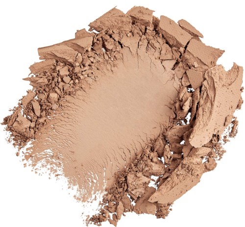 A dust or powder makeup with a crushed, uneven surface and jagged edges.