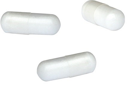 Three white capsules are shown, lying parallel and at different angles on a plain background.