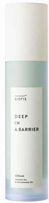 En lang, sylindrisk hudpleieflaske med hvit lokk og lyseblå kropp, merket "Deep in a Barrier".