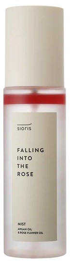 En liten sprayflaske med roselukt, med hvit hette og enkel etikett som sier "Falling Into The Rose."
