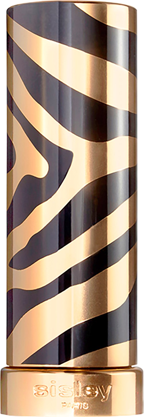 Et højt cylindrisk objekt med sort og guld zebra mønster og guldbund.