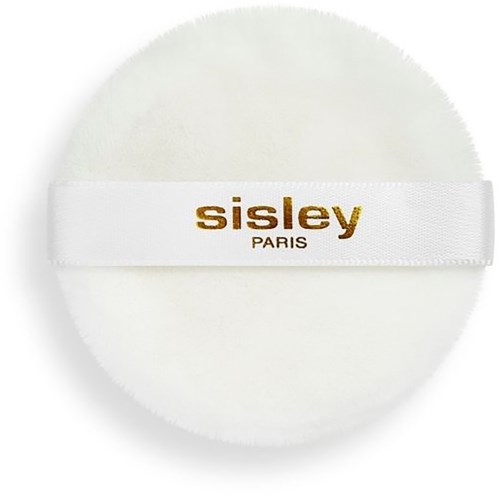 A round white makeup sponge with a band saying sisley PARIS in gold letters.