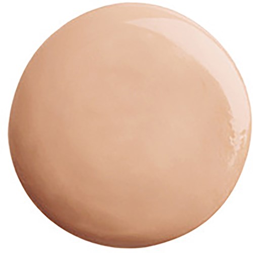 En rund, beige, skinnende gjenstand som ligner en glatt stein eller en stor pille.