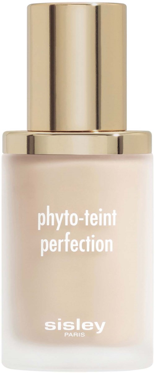 A bottle of Skin Care product named 'phyto-teint perfection' by Sisley Paris with a gold cap.