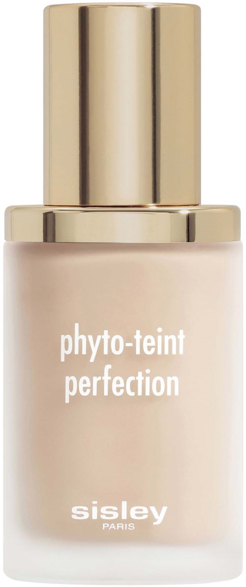 A bottle of Sisley Perfection skincare, with a gold cap and white label. The brand name and product are written on it.
