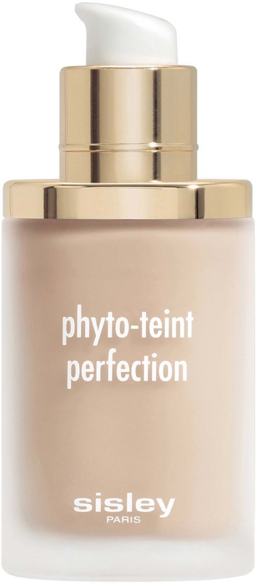A beige pump bottle with gold top, labeled 'phyto-teint perfection' by Sisley Paris, likely a foundation or skincare product.