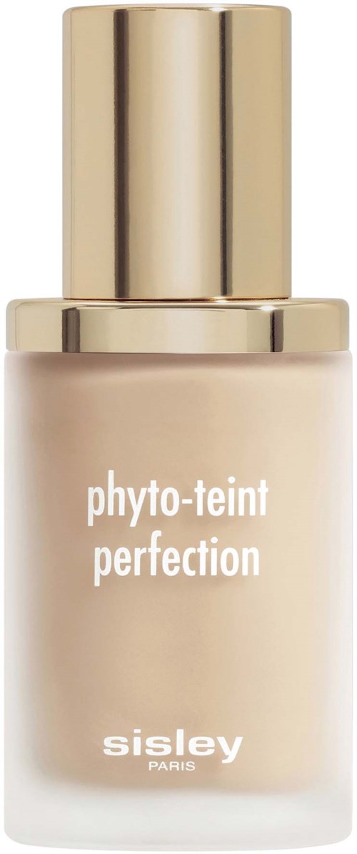 A beige-colored cosmetic bottle with a gold cap, labeled "phyto-teint perfection" by Sisley Paris.