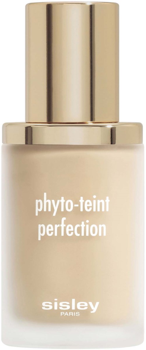 A bottle of Sisley skincare product with a gold cap, labeled 'phyto-teint perfection', in a simple, elegant design.