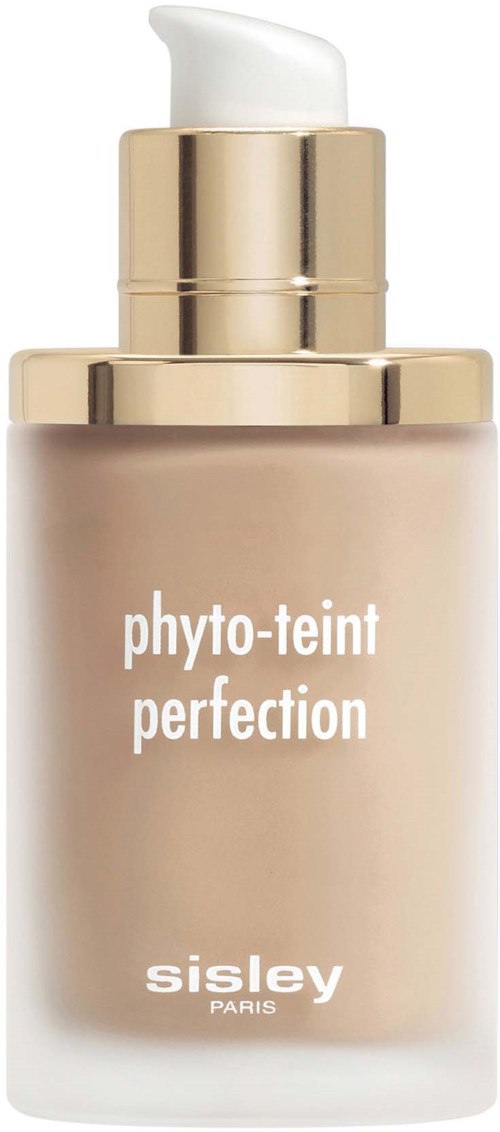 A beige bottle with a gold cap, labeled 'phyto-teint perfection' and 'sisley paris', contains foundation or skin product.