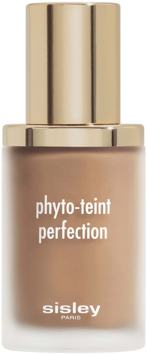 A bottle of foundation with a gold cap, labeled "phyto-teint perfection" by Sisley Paris.