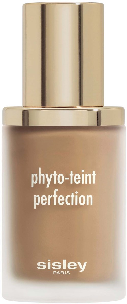 This is a bottle of foundation makeup from Sisley with a gold cap. It has the words 'phyto-teint perfection'.