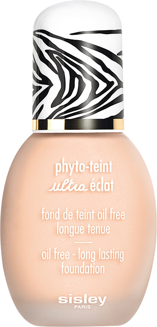Beige-meikkipullo, jossa on zebra-kuvioinen korkki, merkki 'Sisley Paris'.