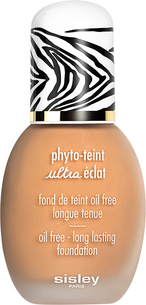 Olejaton, pitkäkestoinen perusvoide pullossa, jossa zebra-kuvioitu korkki ja beige neste.