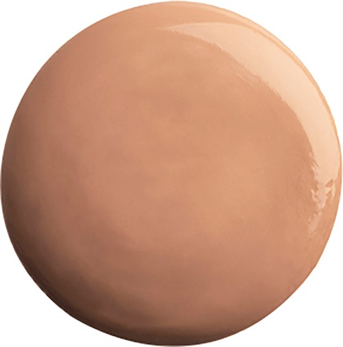 Hionta ja pyöreä beige-esine, kiiltävä ja tasainen väri.