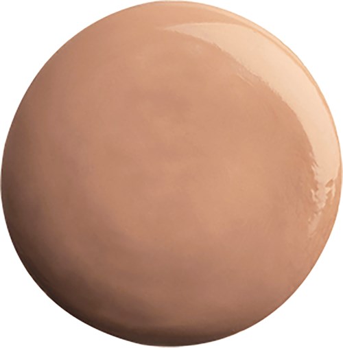 Beige, sileä, pyöreä muna kiiltävällä pinnalla.