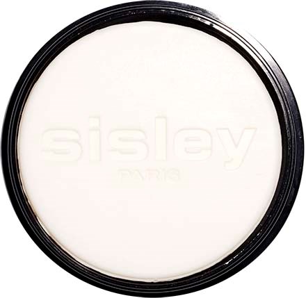En rund hvid makeup-kabinet med navnet Sisley Paris indgraveret svagt indeni.