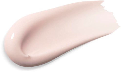 En beige krem eller lotion spredt over en hvit bakgrunn, med en glatt, buet form.