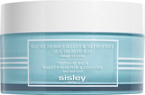 En blå och vit burk med make-up remover och rengöringsmedel från Sisley för ansikte och ögon.