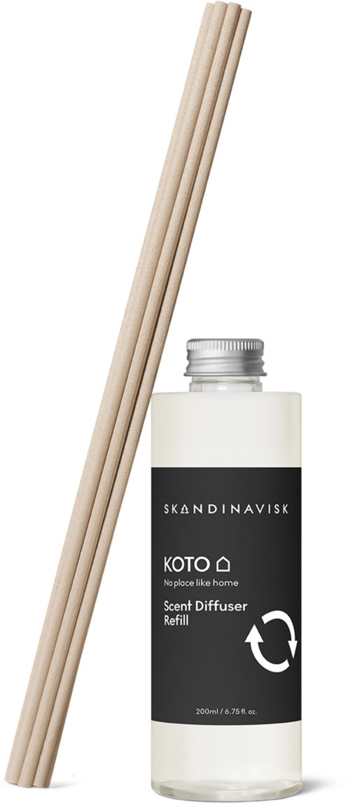 A scent diffuser refill bottle with three wooden sticks.