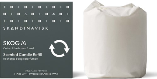 A box with Scandinavian symbols, scented candle refill, and a wrapped package.