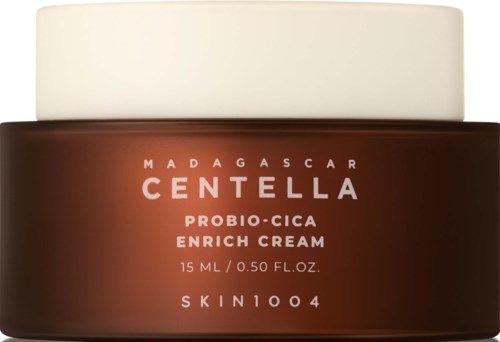 Brun krukke med hvit lokk merket Madagascar Centella Probio-Cica Enrich Cream, 15 ml.
