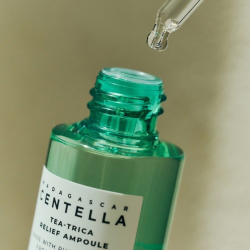 En grønn flaske med en pipette over, etiketten leser 'GENTELLA'.