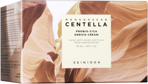 Eske med Madagascar Centella serum, med naturlige steinmotiv og enkel hvit etikett.
