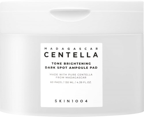 Ein weißer Behälter mit einem Etikett für Madagascar Centella aufhellende dunkle Flecken Ampullenpad und Produktdetails.