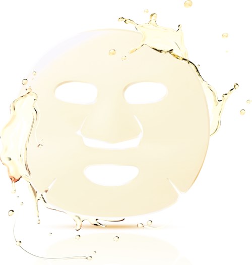 Ett ansiktsmask med hål för ögon, näsa och mun, omgiven av vätskefläckar.