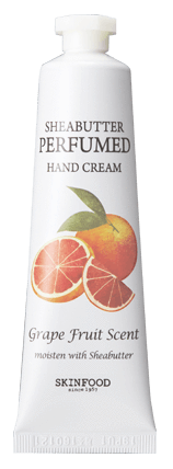 En vit tub med handkräm med grapefruktbild, märkt 'Sheabutter Perfumed Hand Cream.'