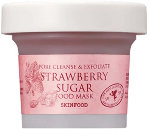 Pink behållare med en etikett som visar jordgubbar, socker och hudvårdstext. Det är en matmask för rengöring och exfoliering.