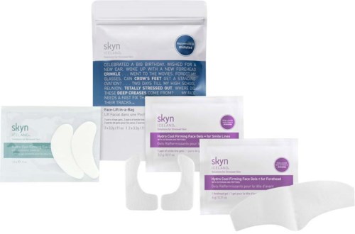 Skyn skincare products for face and forehead, including a small white pad and packaging boxes, are shown.
