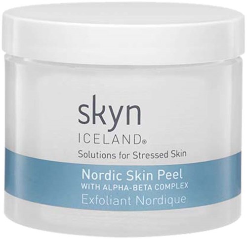 A white jar of Skyn Iceland skincare, labeled as Nordic Skin Peel for stressed skin, with blue and black text.