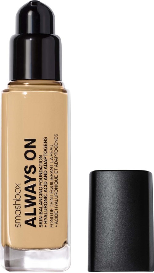 A bottle of Smashbox Always On foundation with a black cap and beige liquid inside.
