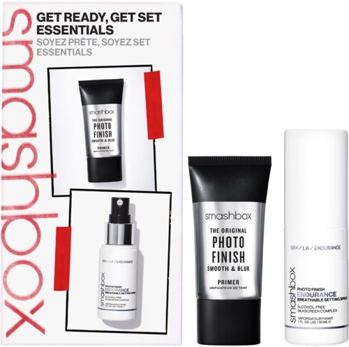A kit with skincare products: a tube, a spray bottle, and a white pump bottle, labeled for skin smoothing and finishing.