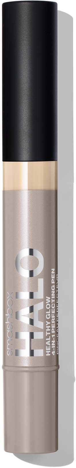 A concealer stick with a black cap, clear middle showing skin tone, and brand name "TAR" on it.